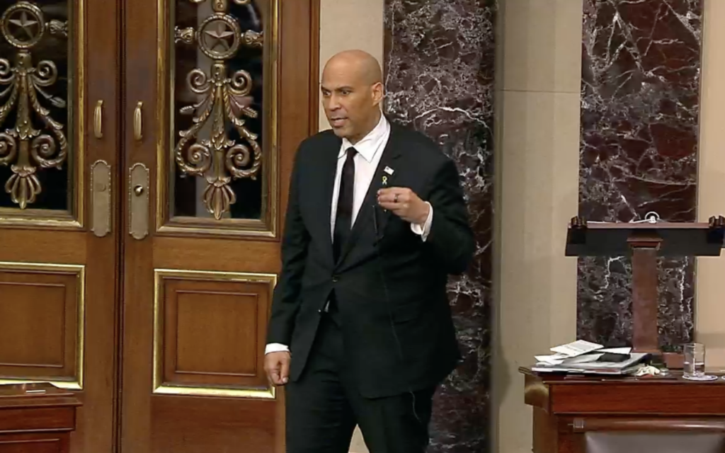Sen. Cory Booker wears a hostage pin during a marathon speech on the Senate floor, April 1, 2025. (Screenshot)